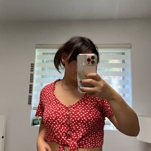 Red and white floral blouse